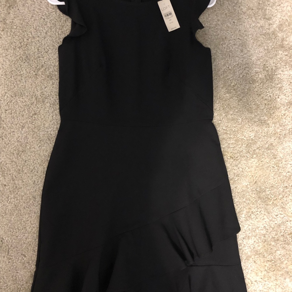Knee length black cocktail dress